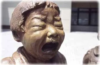 The bronze face of the crying girl